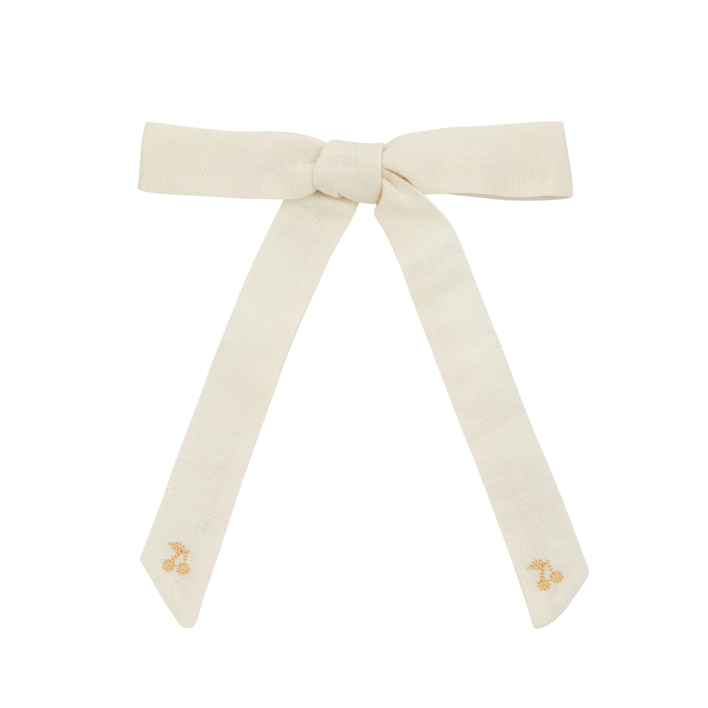 Cream-colored bow with small decorative elements on a white background