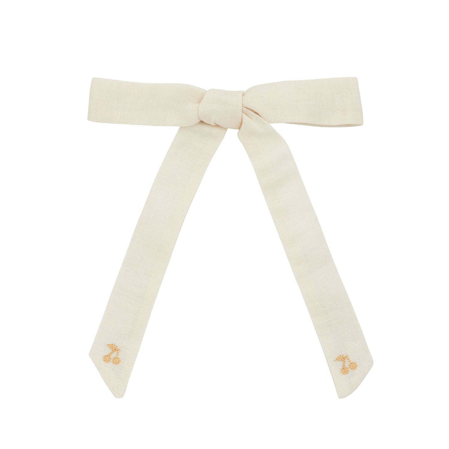 Cream-colored bow with small decorative elements on a white background